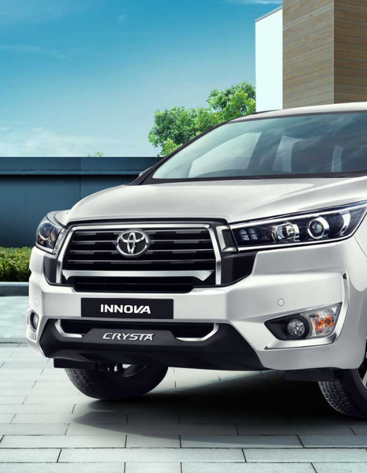 Toyota Innova from Just Cab Hire on a scenic road at sunrise