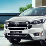 Toyota Innova from Just Cab Hire on a scenic road at sunrise